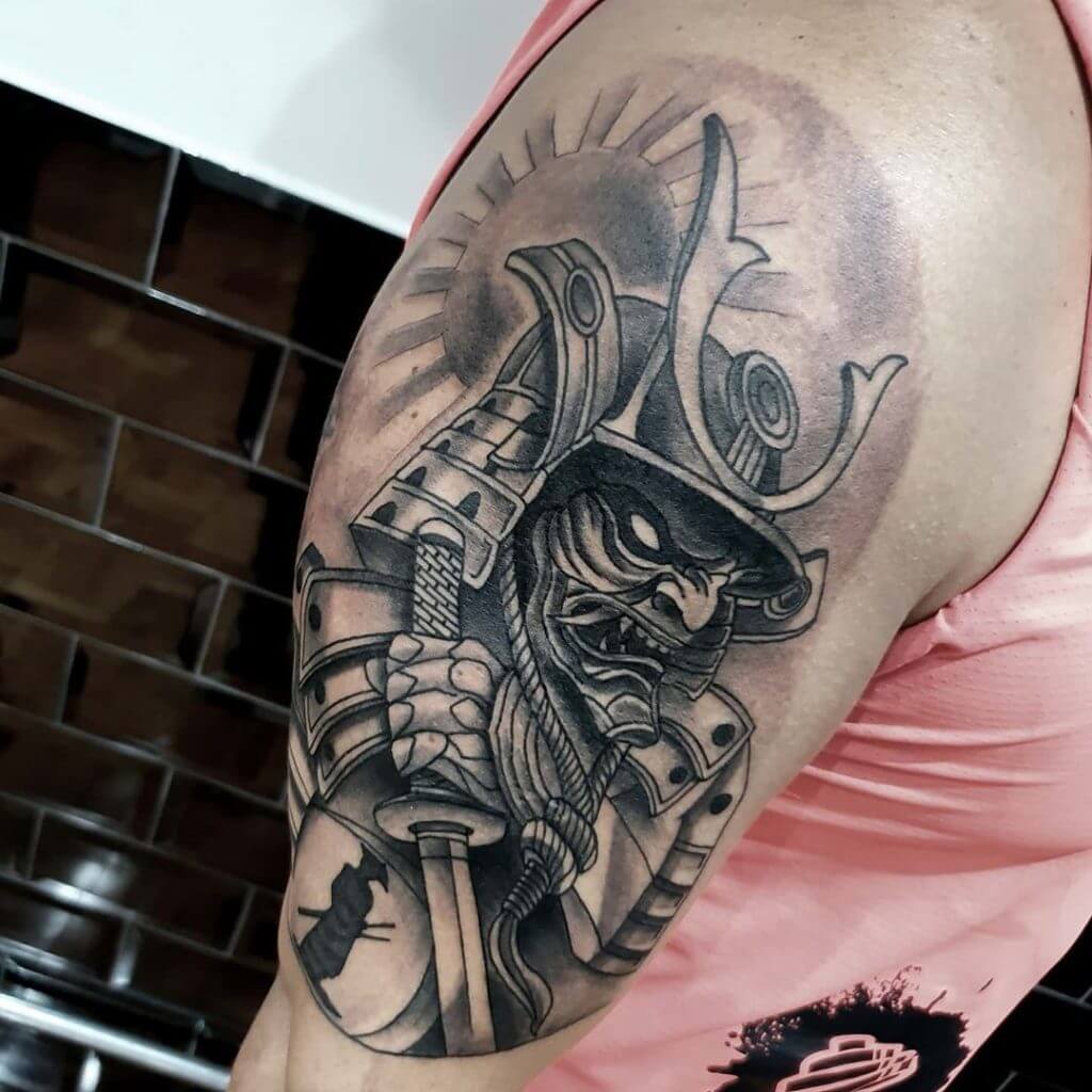 Black Samurai tattoo on the right arm