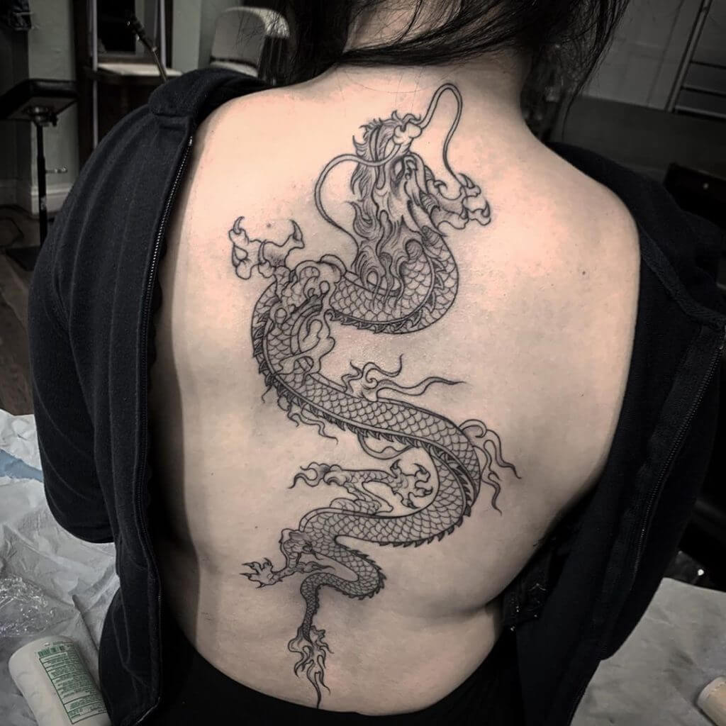Black dragon tattoo for woman on back