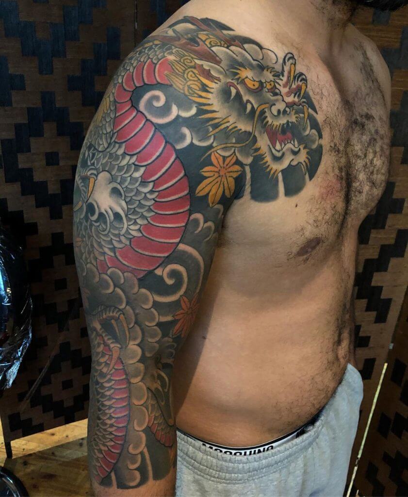 Color dragon tattoo for man on the right shoulder