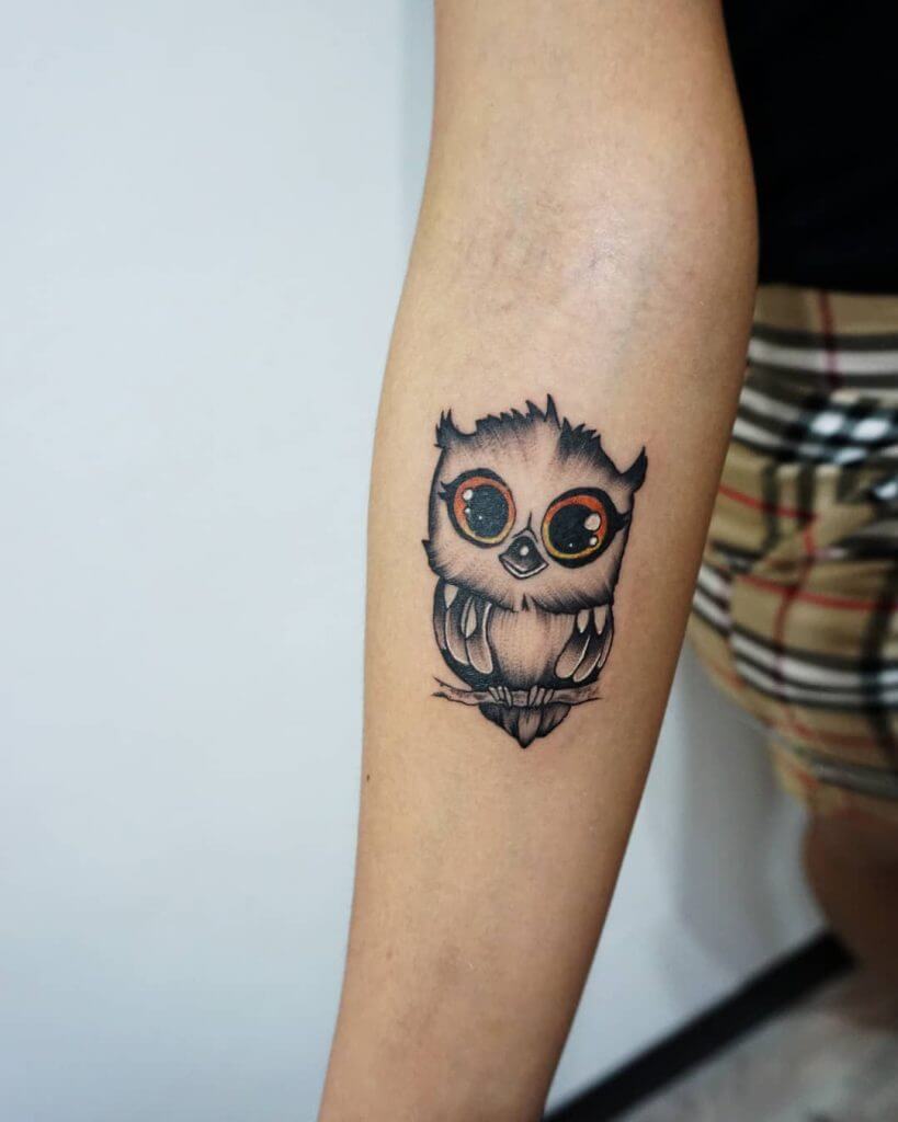 Small owl tattoo for women, on the right forearm