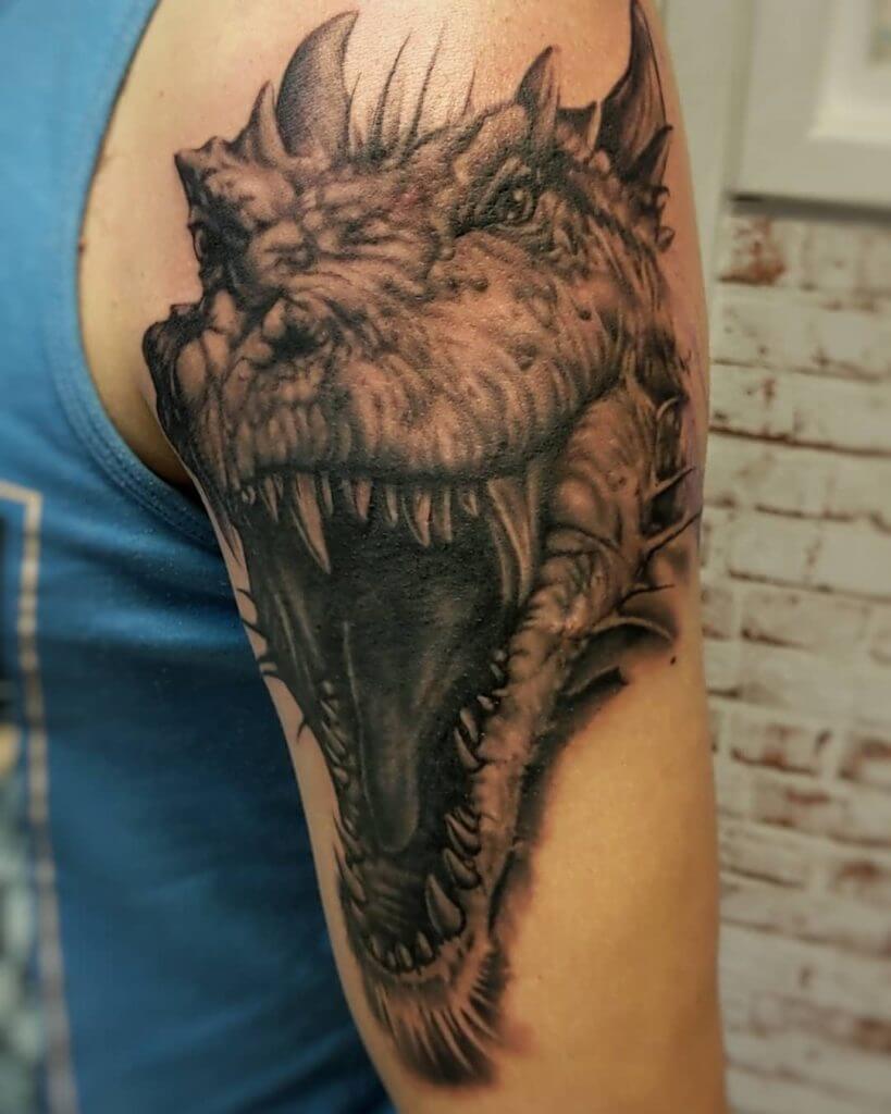 Black dragon tattoo for man on the left arm