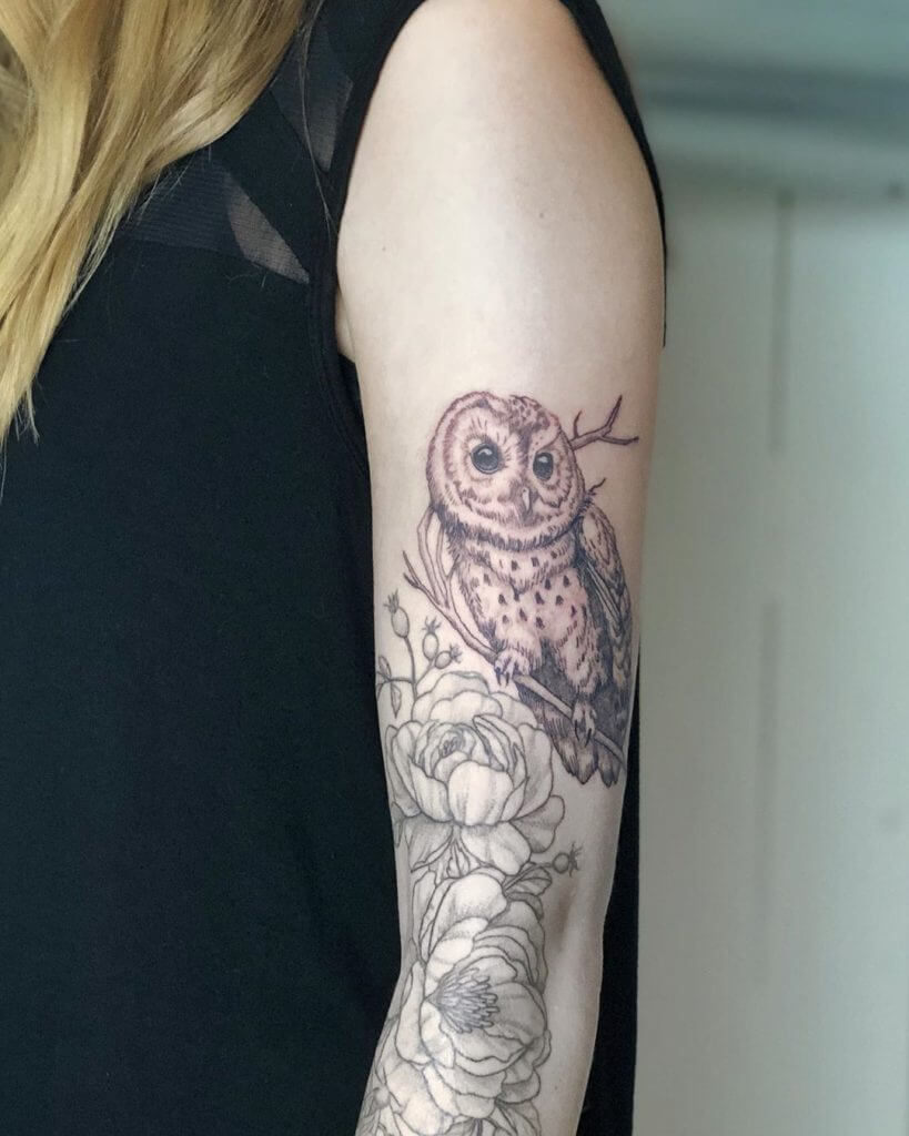 Black owl tattoo for women, on the left arm