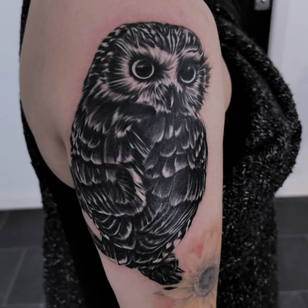Black owl tattoo for women on the right arm