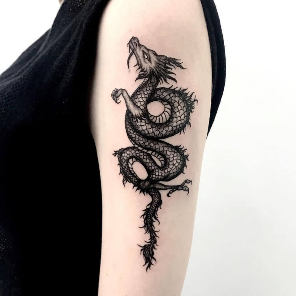 Black dragon tattoo for woman on the left arm