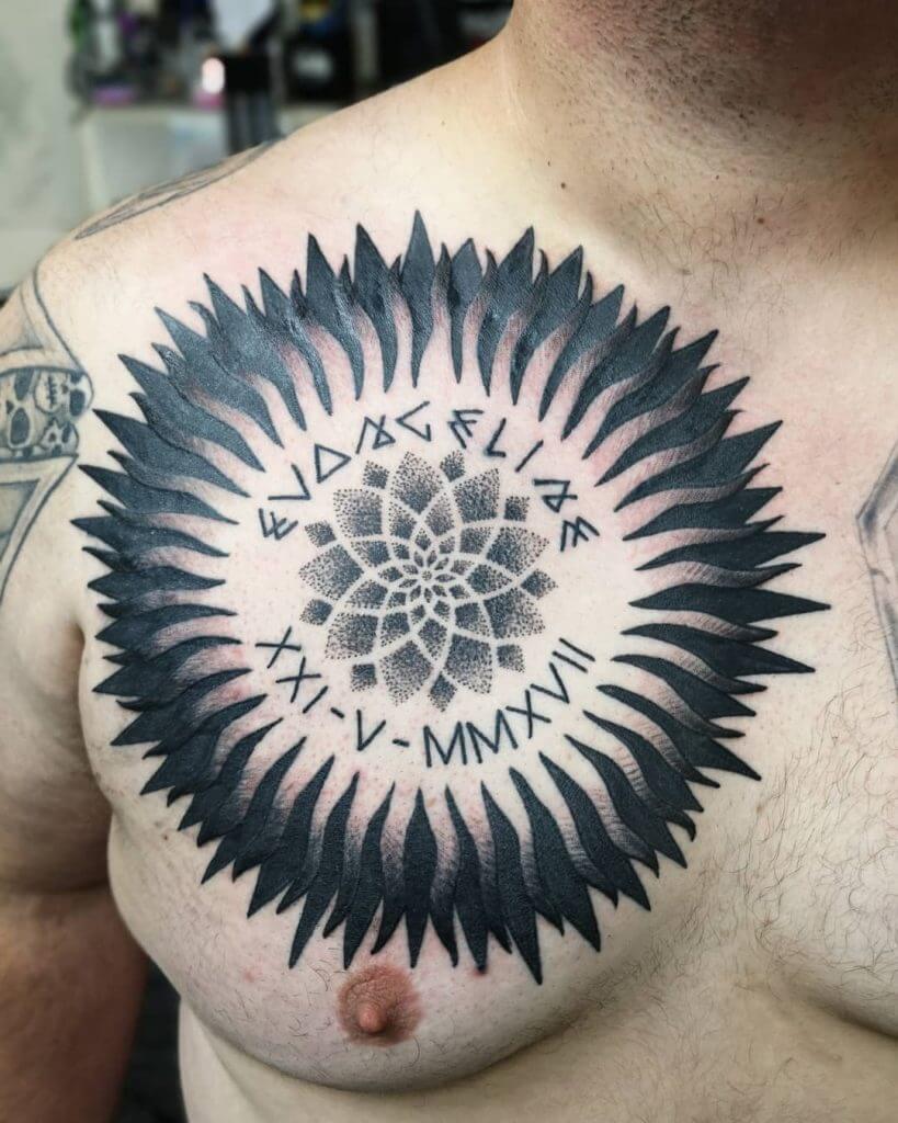 Black sun tattoo on the chest