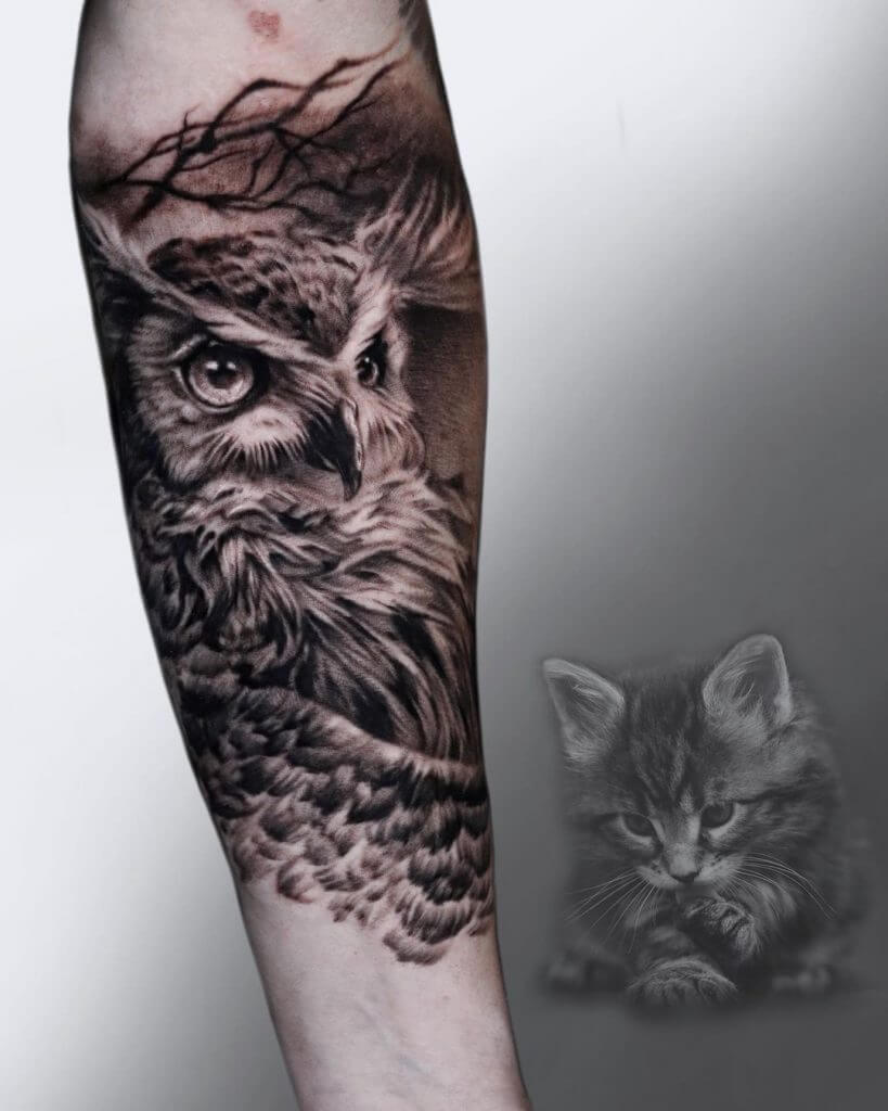Black owl tattoo for men on the right forearm