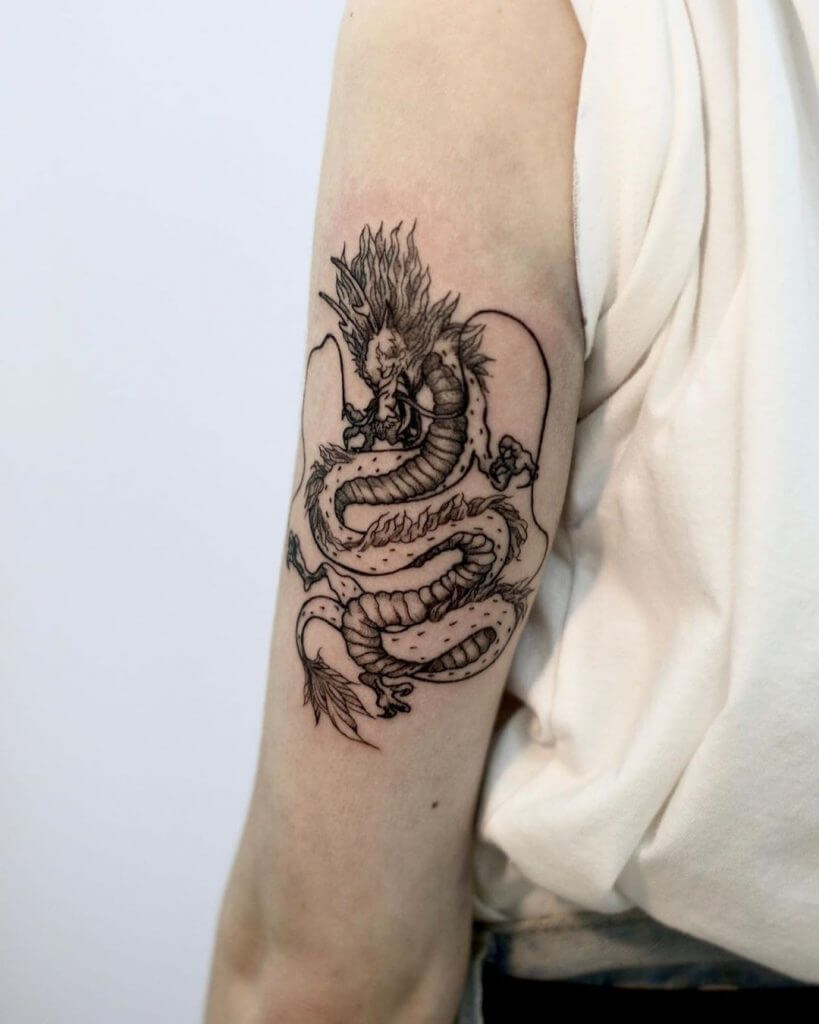 Black dragon tattoo for woman on the left arm