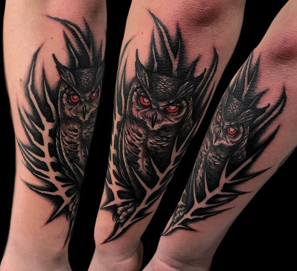 Black owl tattoo for men on the left forearm