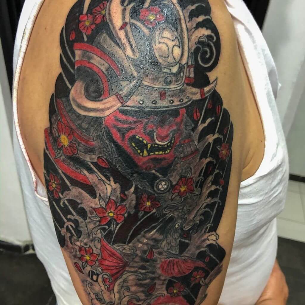 Color samurai mask tattoo on the arm