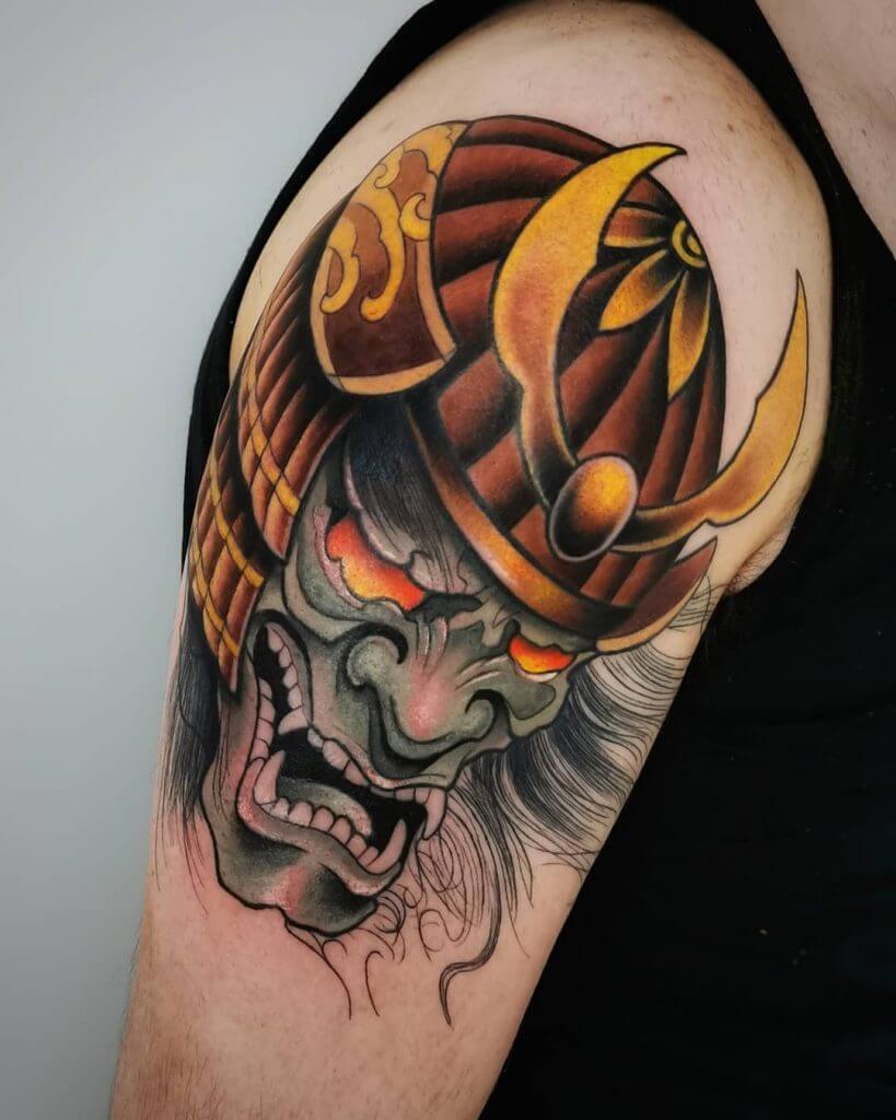 Color samurai mask tattoo on the arm