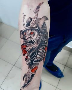 Samurai mask tattoo on the forearm