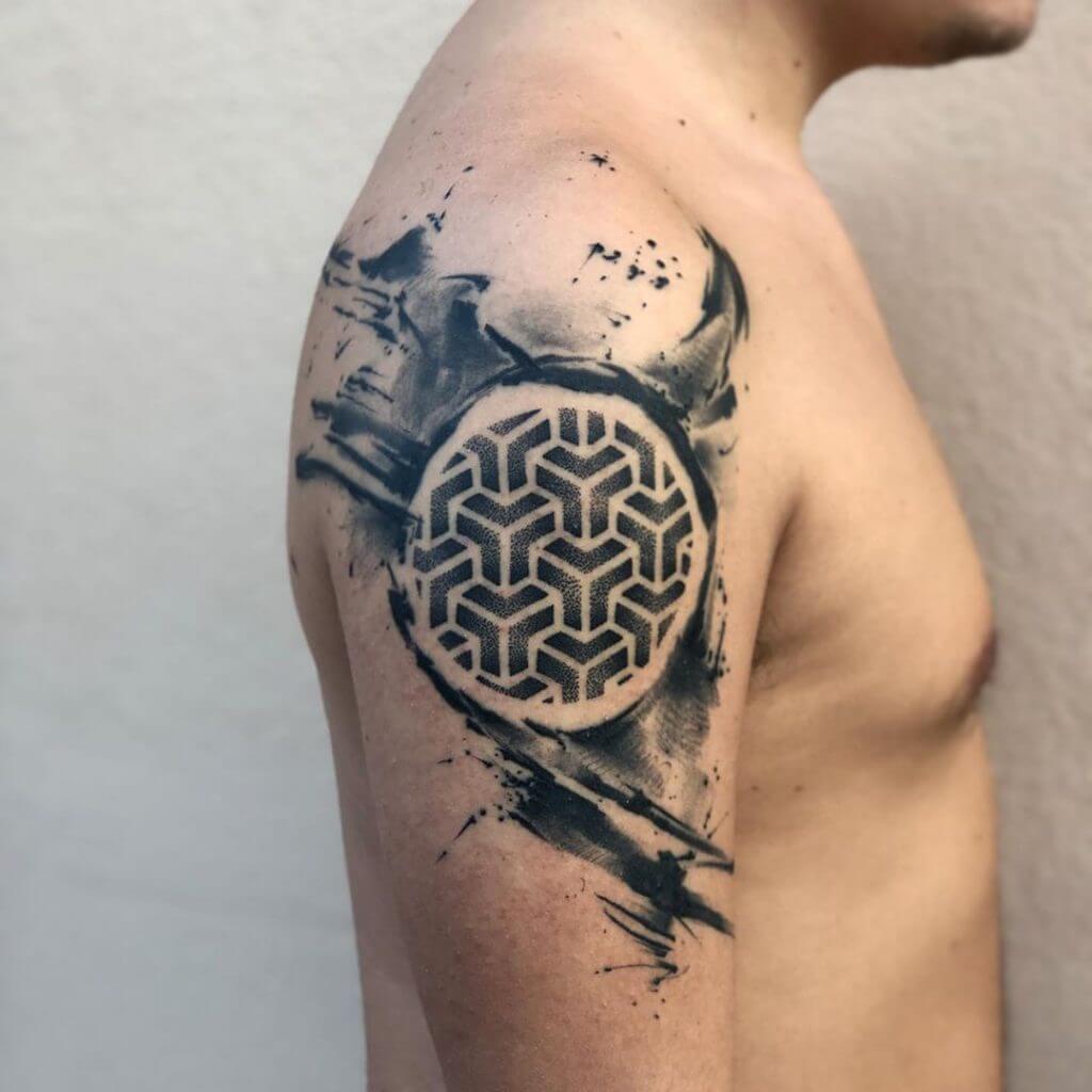 Abstract geometric tattoo on the right shoulder