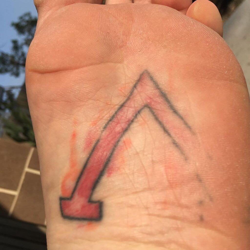 Faded foot color tattoo