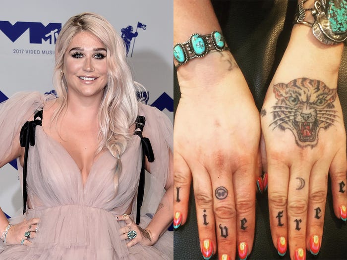 Kesha got Live free tattooed on her fingers and bunch of other small tattos on her body