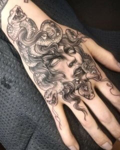 Medusa tattoo on hand for men and women 5