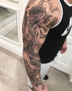 Sleeve tattoos with a phoenix theme 2