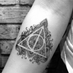 Deathly hallows forearm tattoos are really trendy these days 5