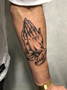 Interesting forearm praying hands tattoos 2