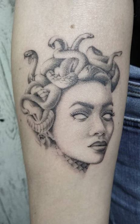 Medusa tattoo on the forearm