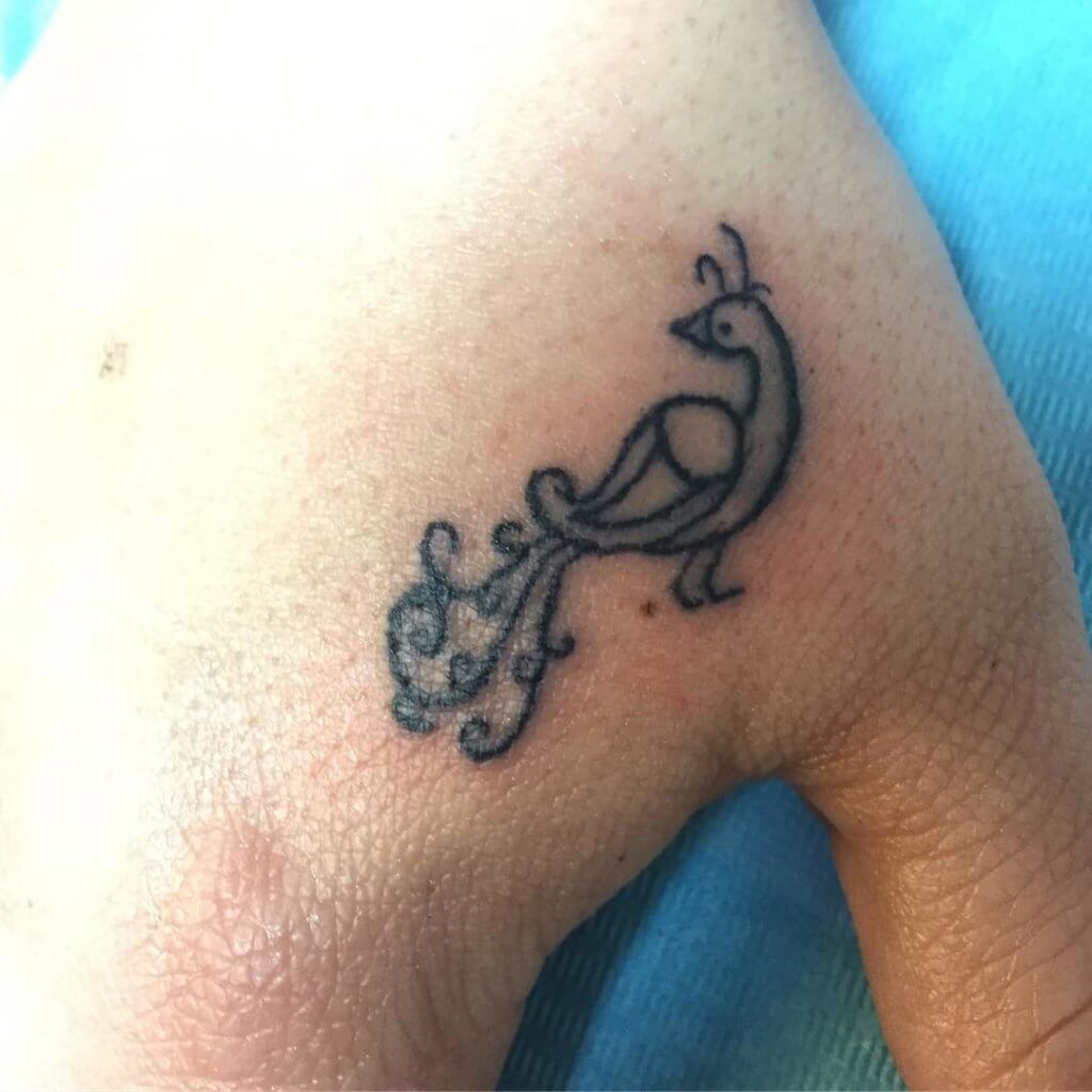 Reach the excellence with simple peacock tattoos 4