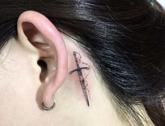 Safely start with world of tattoos with really cool small sword tattoo