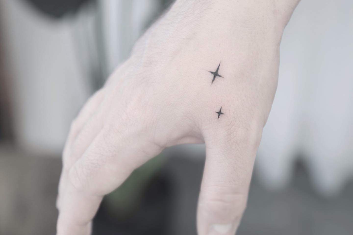 Unconventional minimalist approach with stars tattoo Unconventional minimalist approach with stars tattoo