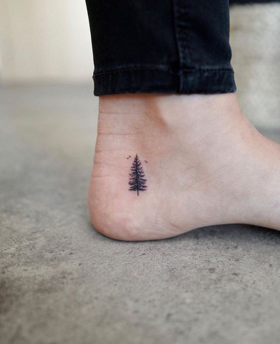 Why not check these extraordinary minimalist pine tree tattoo designs