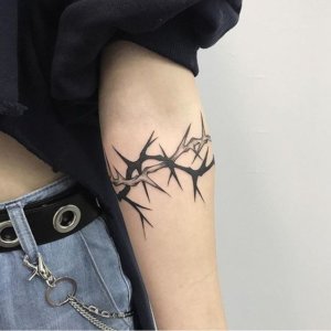 10 Mind blowing crown of thorns tattoos 2
