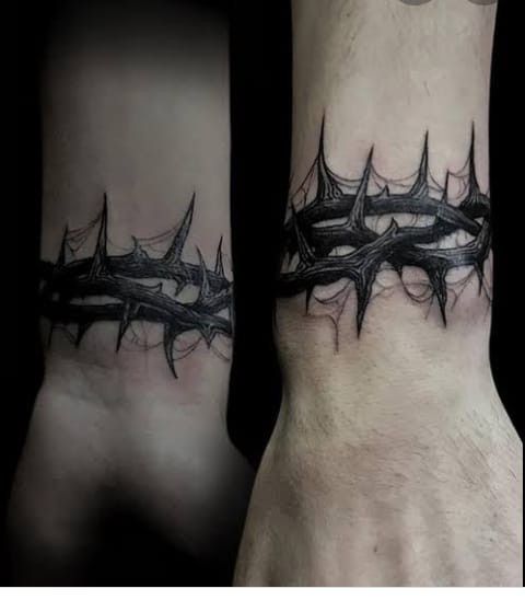 Crown of thorns tattoo on wrist is really stunning. Check it here