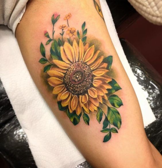 Gorgeous sunflower tattoo ideas to make your arm delightful