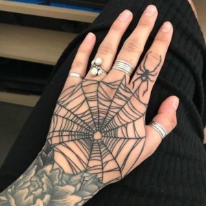 If you want breathtaking spider web tattoo get it on your hand 2