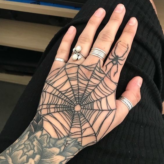 If you want breathtaking spider web tattoo get it on your hand