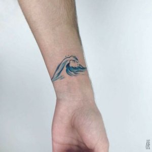 Inspiration of stunning wave tattoos on wrist 5