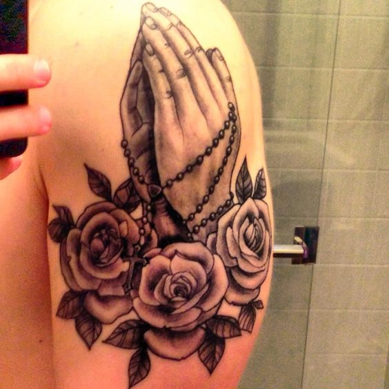praying hands with rosary tattoo on chest