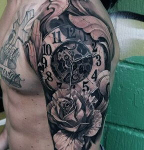 Some of the best clock shoulder tattoos by our opinion 1