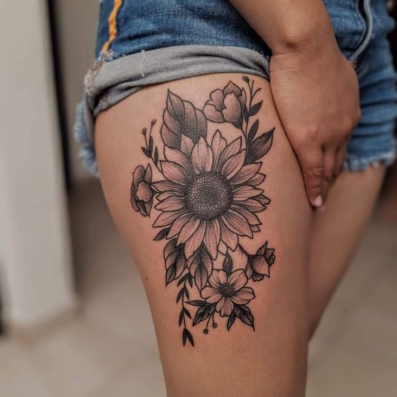 Why Not Be Glamorous And Powerful With Sunflower Thigh Tattoo