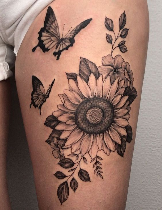 Why Not Be Glamorous And Powerful With Sunflower Thigh Tattoo