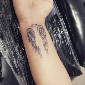 Are you religious Be inspired with these 15 unique angel wing wrist tattoos 2