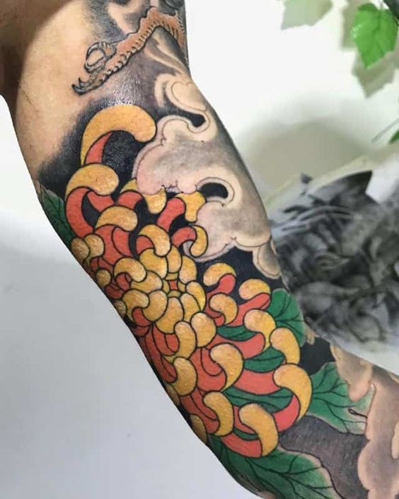 Bicep Yellow chrysanthemum tattoo