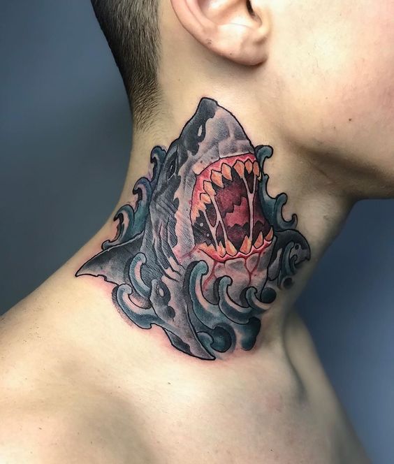 Neck shark tattoo with an open mouth