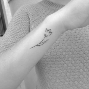 Ideas how to be more beautiful with simple tulip tattoo 6