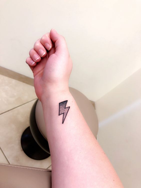 Detailed wrist lightning tattoo design that portrays the raw power and awe-inspiring beauty of lightning.