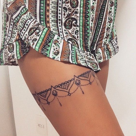Make your body even sexier with these garter tattoo ideas for thigh