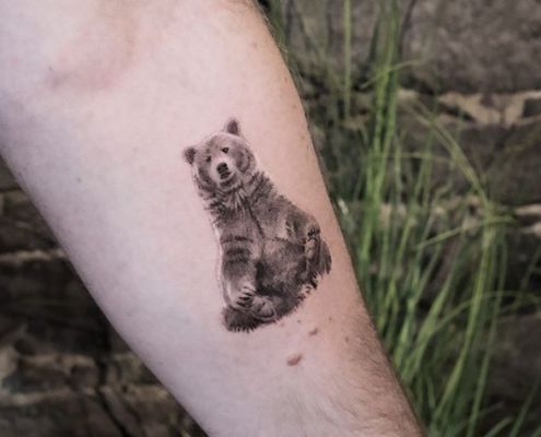 Realistic bear tattoo on calf