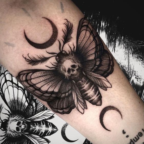 Forearm moth tattoo