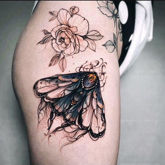 Color moth tattoo on the side