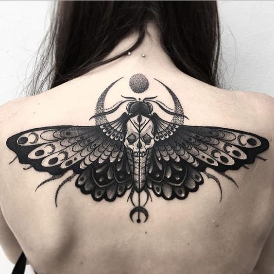 Moth tattoo on the back