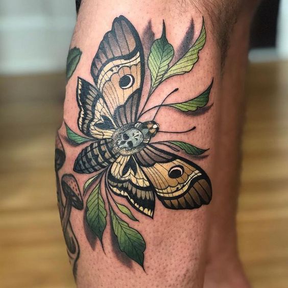 Colorr moth tattoo on the calf