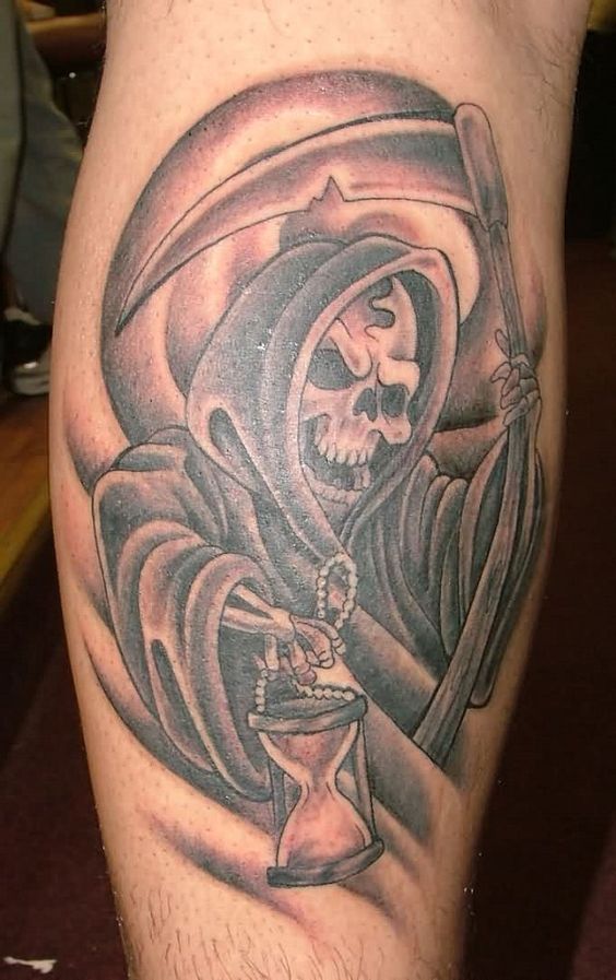 Calf hourglass tattoo with death