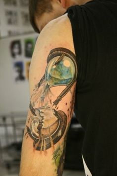 Shoulder broken hourglass tattoo